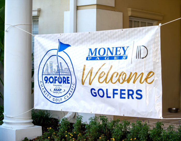 Welcome golfers banner for the Money Pages Charity Golf Classic, featuring event sponsors and logos.